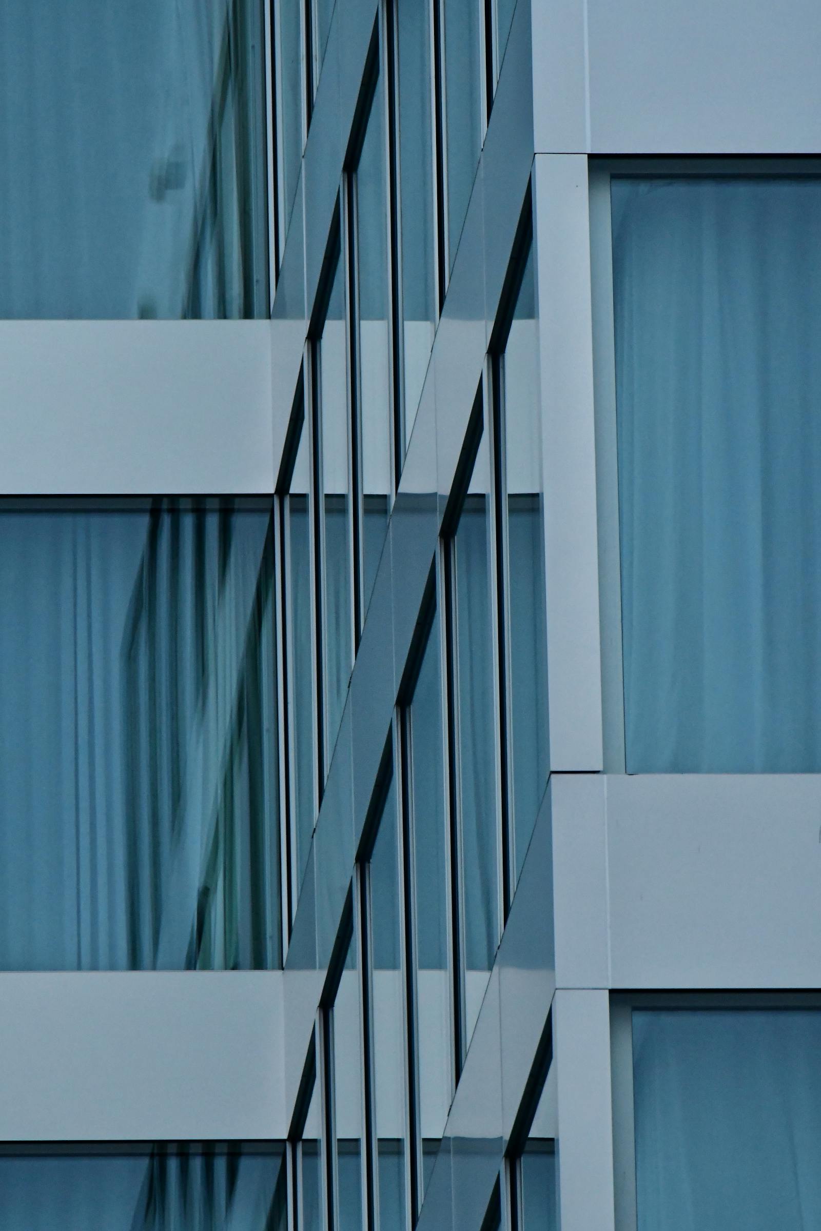 Close-up of modern curtain wall system with reflective glass panels