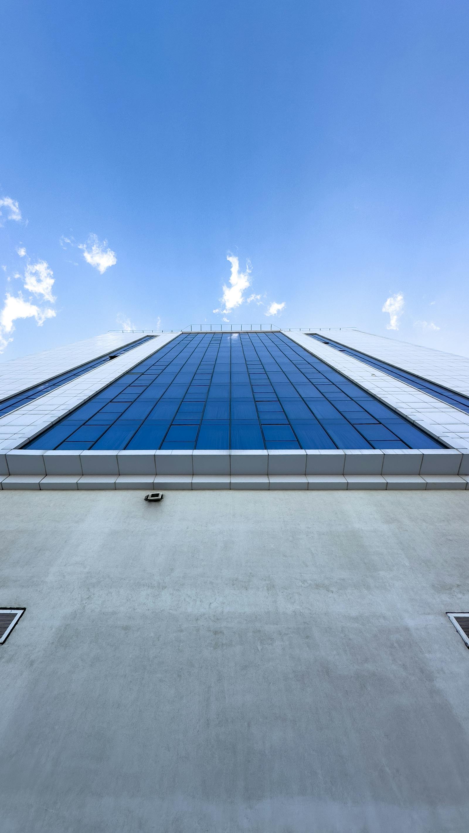 Architectural perspective of glass skyscraper with unitized curtain wall