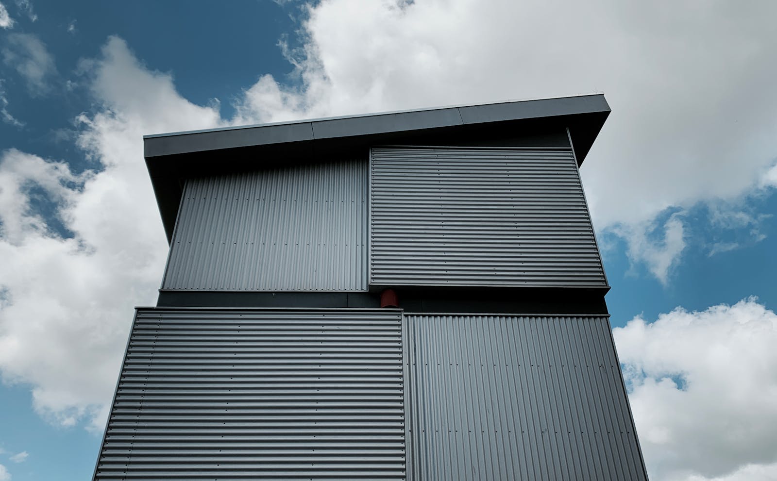 Sleek modern building with vertical steel mullion facade system