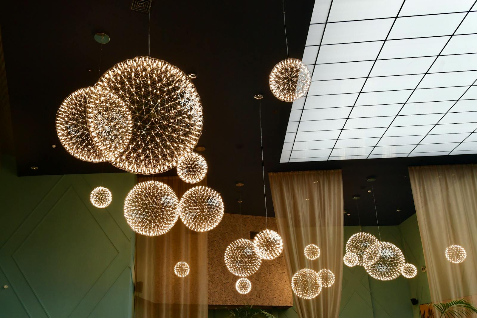 Elegant modern interior with glowing spherical chandeliers