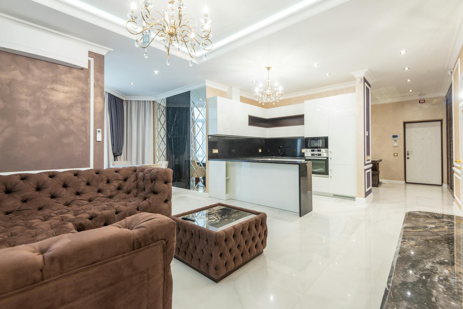 Luxurious open-plan living room with modern interior design and elegant lighting