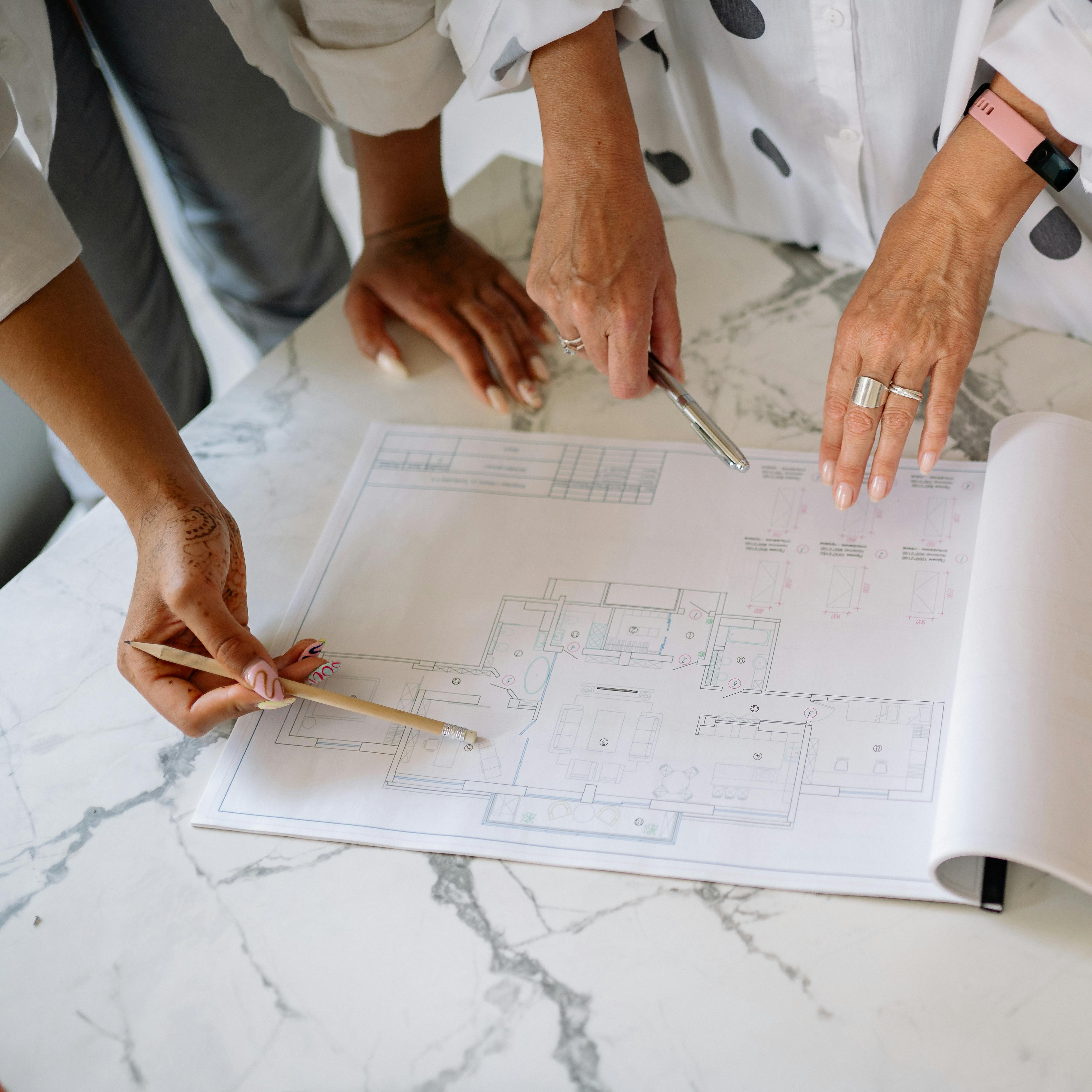 H2Z team reviewing architectural blueprints